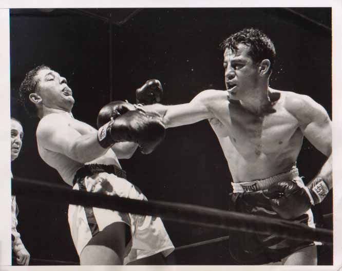 This vintage press photo shows former middleweight champ Rocky Graziano lan...